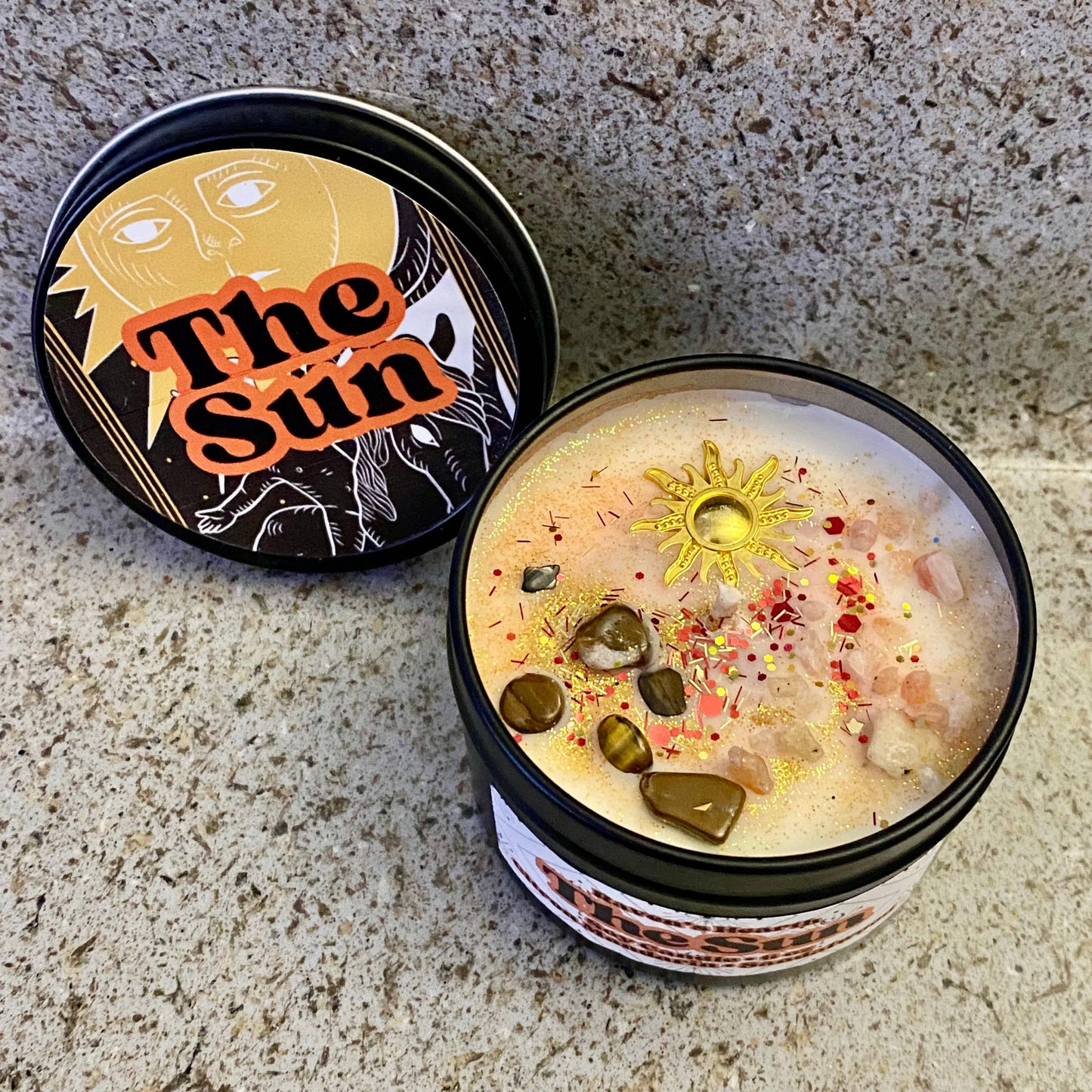 the sun tarot card candle with tigers eye crystals