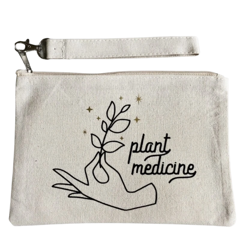 White cotton Zippered Pouch with hand hold plant. Says Plant Medicine