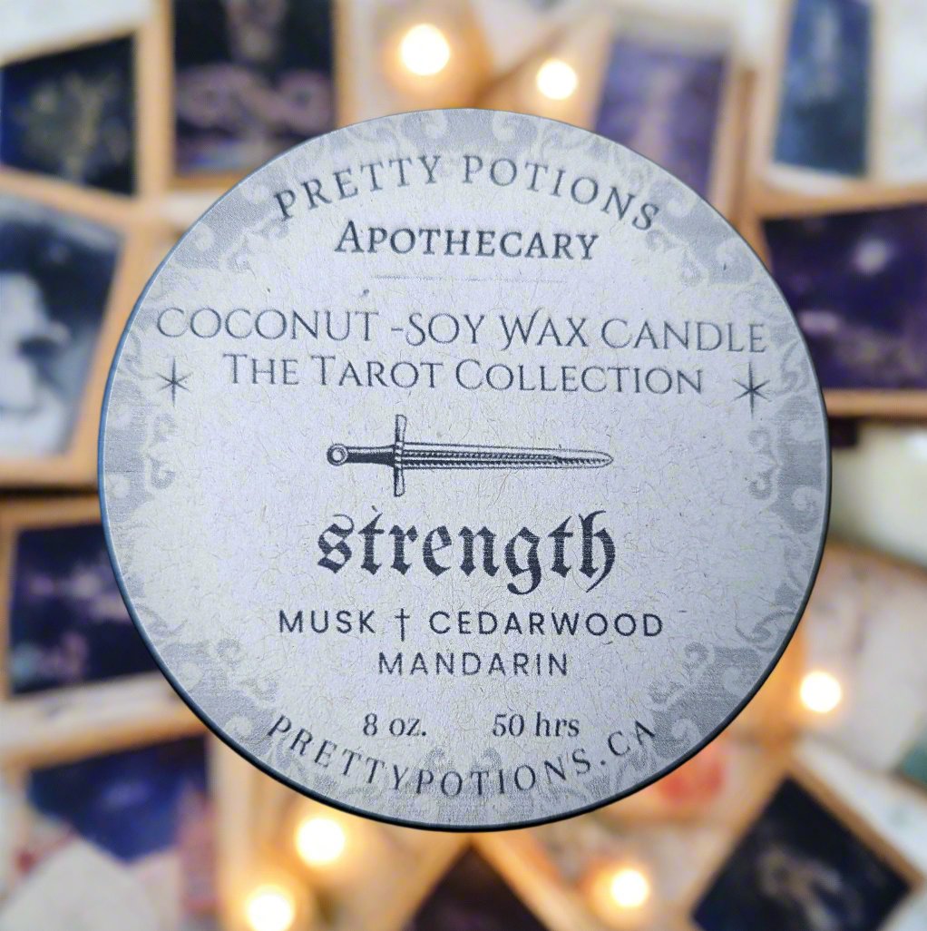 strength tarot card candle top with cedar wood and mandarin scent