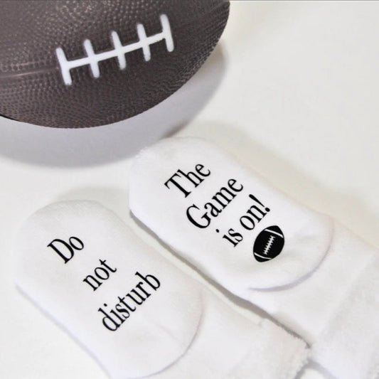 baby socks do not disturb the football game is on. baby socks for new dad's