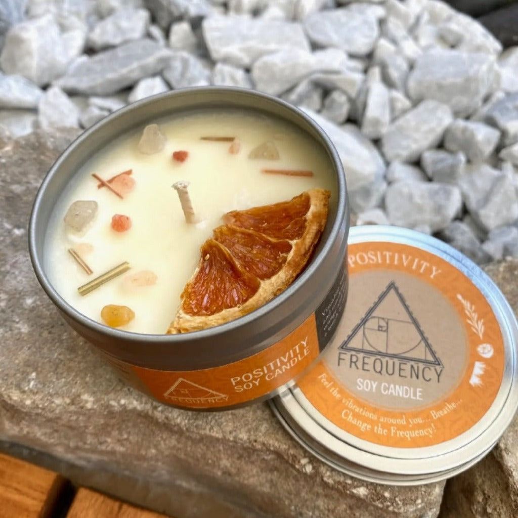Visualize warm spring breezes, fresh citrus, and sunshine.    This citrusy blend of lemon, orange and lemongrass is rounded out with a touch of rosemary and peppermint.    This crystal soy candle is topped with pink himalayan sea salt, golden jade crystals, dried orange peel, dried lemongrass.